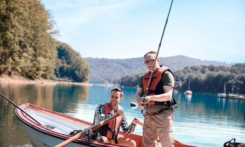 son-and-father-bonding-during-fishing-on-jetty-8FUD5A6-resize.jpg